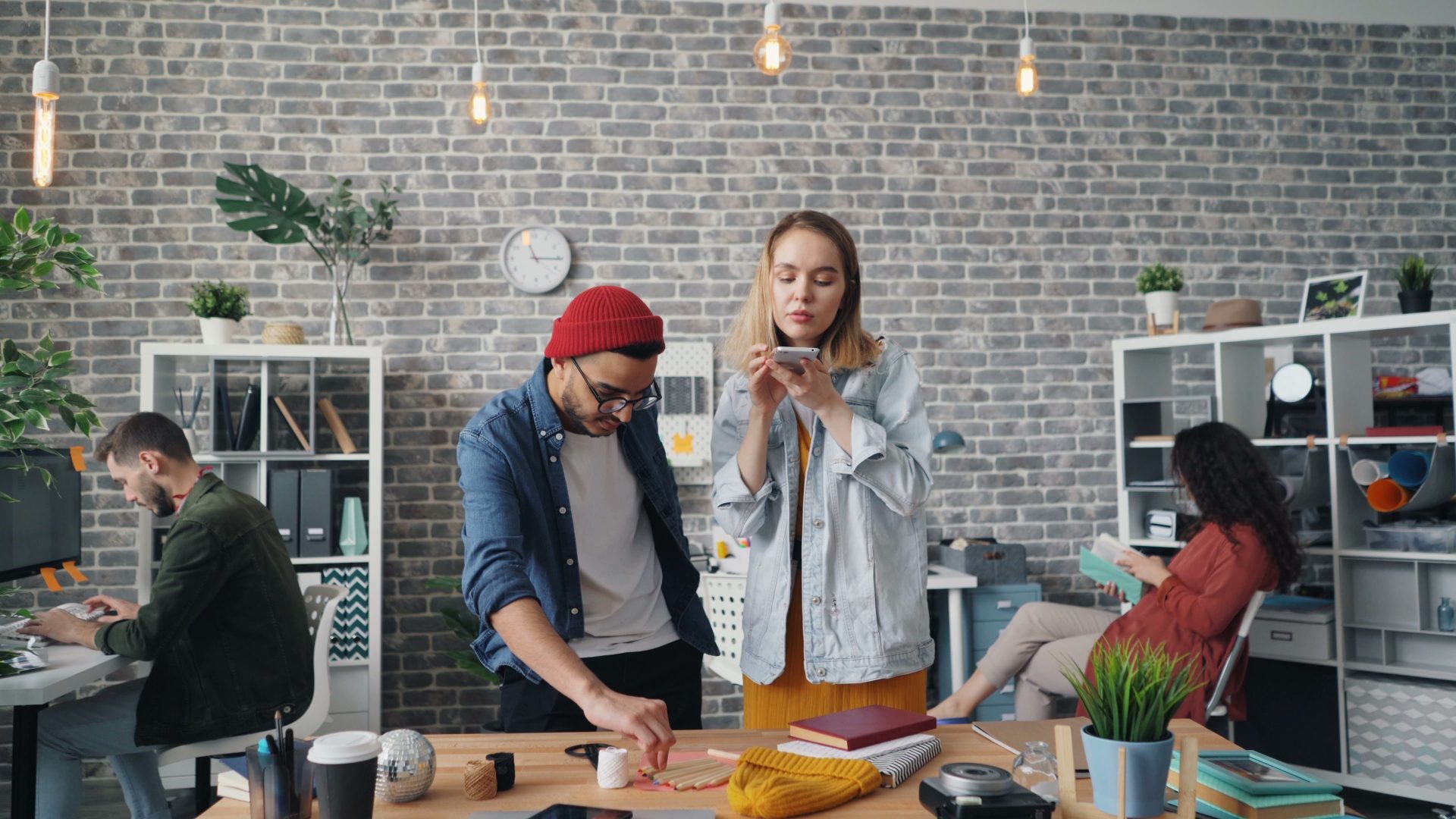 A diverse team working together in a modern office setting, fostering creativity and teamwork.